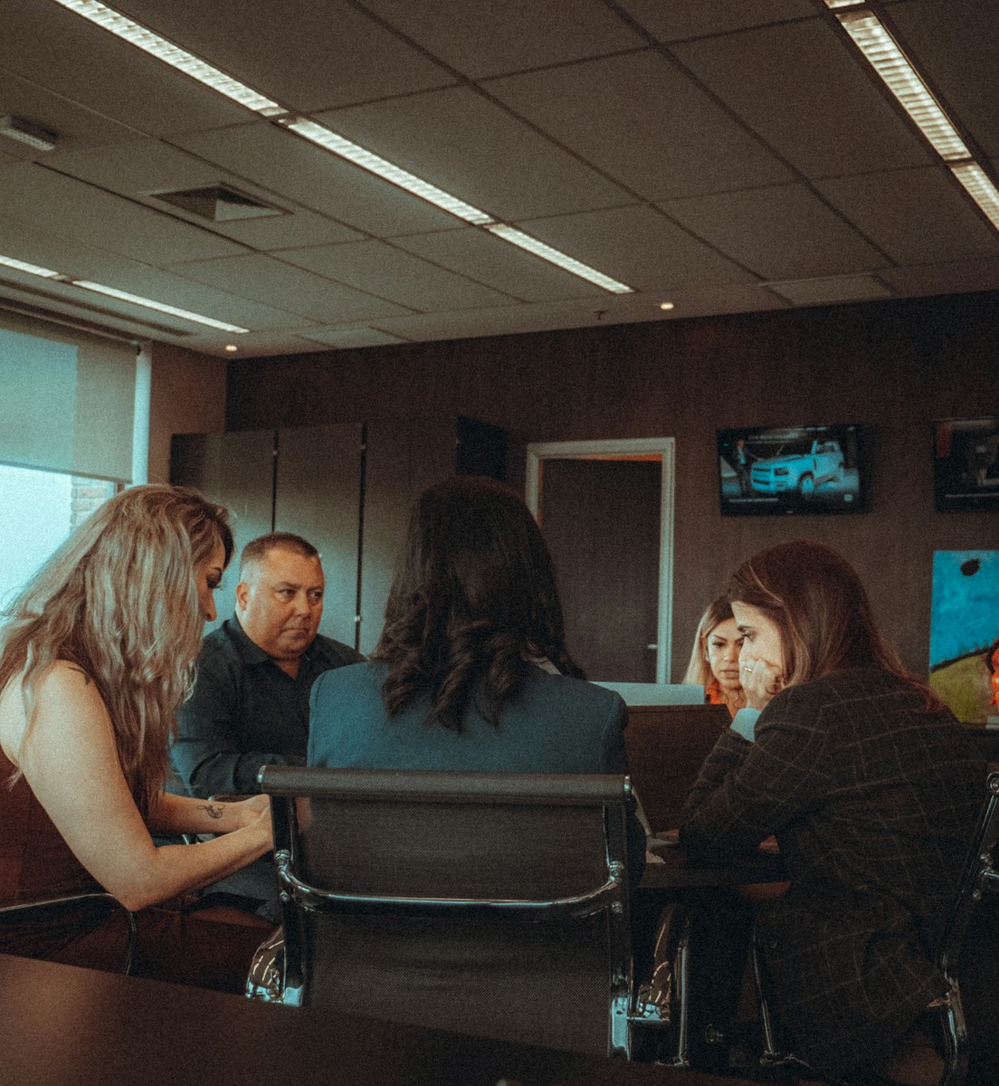a group of people sitting around a table